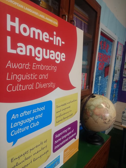 Home in Language poster in the school library