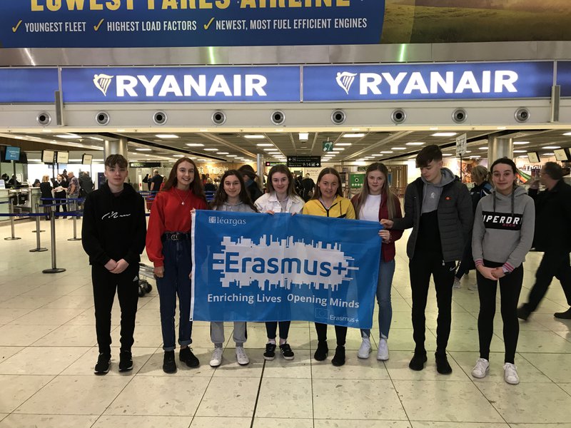 Students at Dublin Airport with their Erasmus+ flag